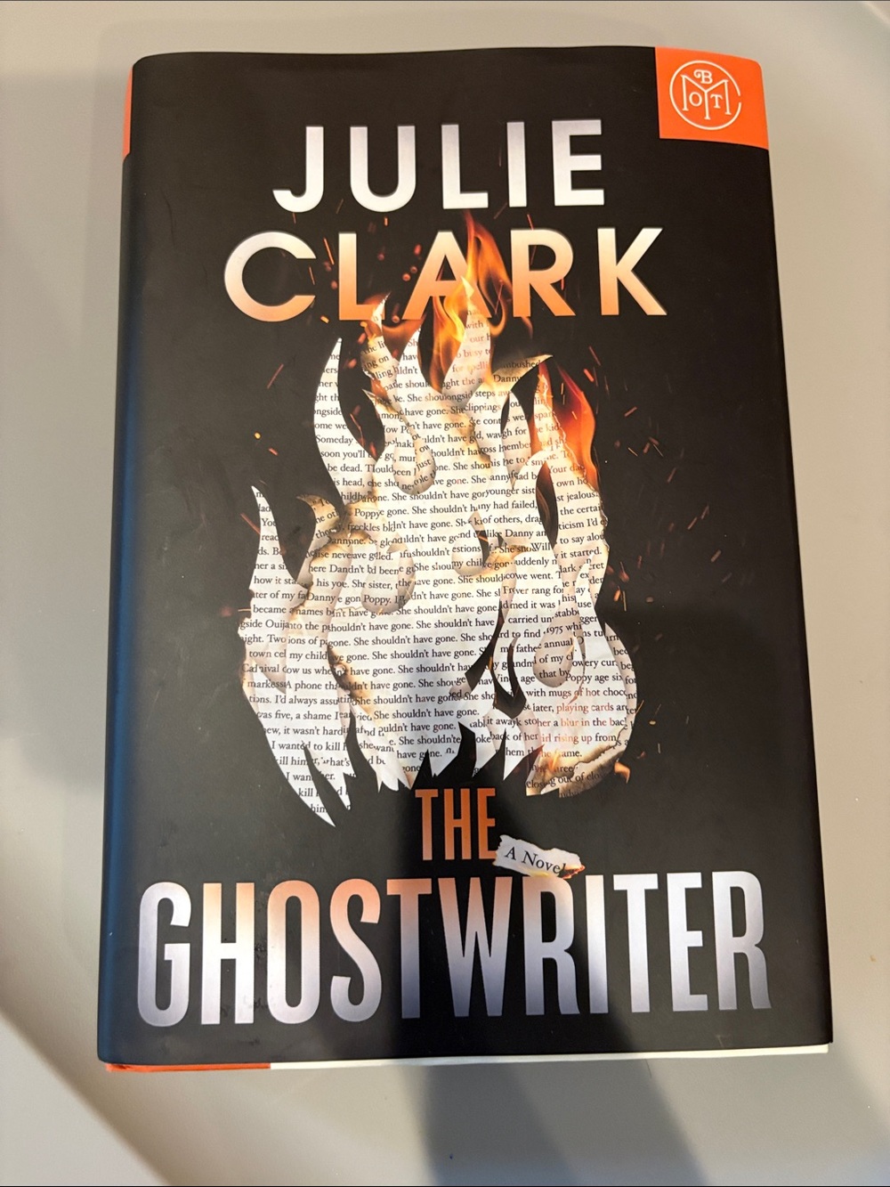 Julie Clark The Ghostwriter Hardcover Book - Black and Orange